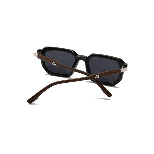 Sunglasses with black lenses and brown wooden frames on a white background