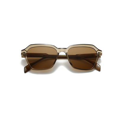 Sunglasses with brown lenses and gold frame on a white background