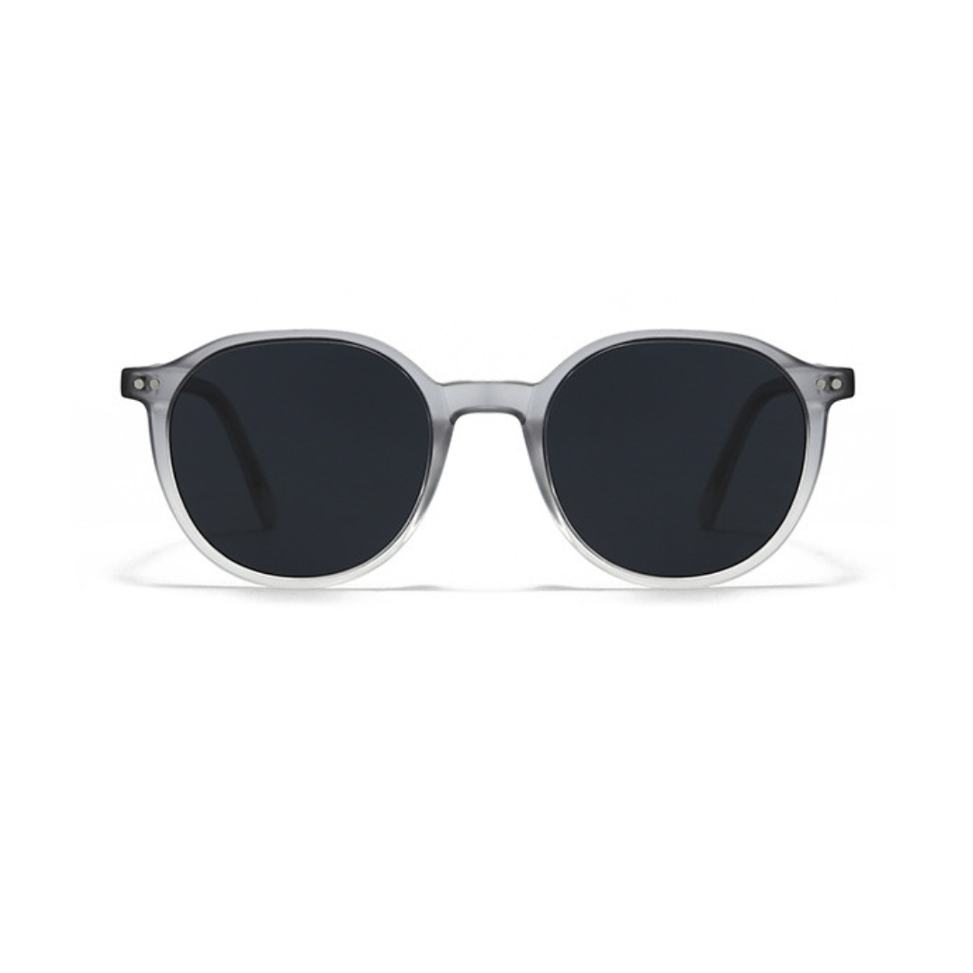 Sunglasses with dark lenses and clear frame on a white background