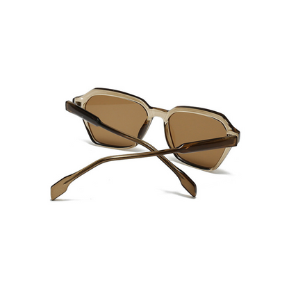 Sunglasses with brown lenses and gold frames on a white background