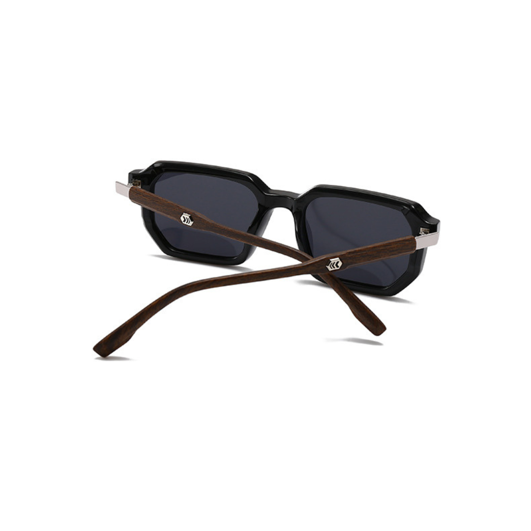 Sunglasses with black lenses and brown wooden frames on a white background