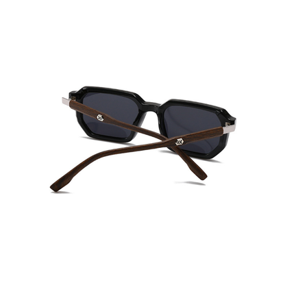 Sunglasses with black lenses and brown wooden frames on a white background
